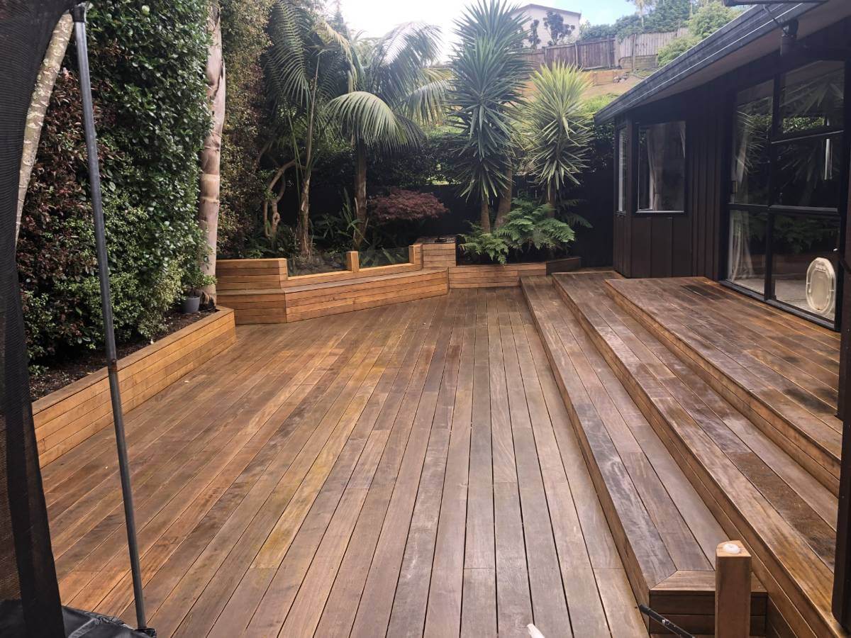 Large new deck with backdrop of native trees