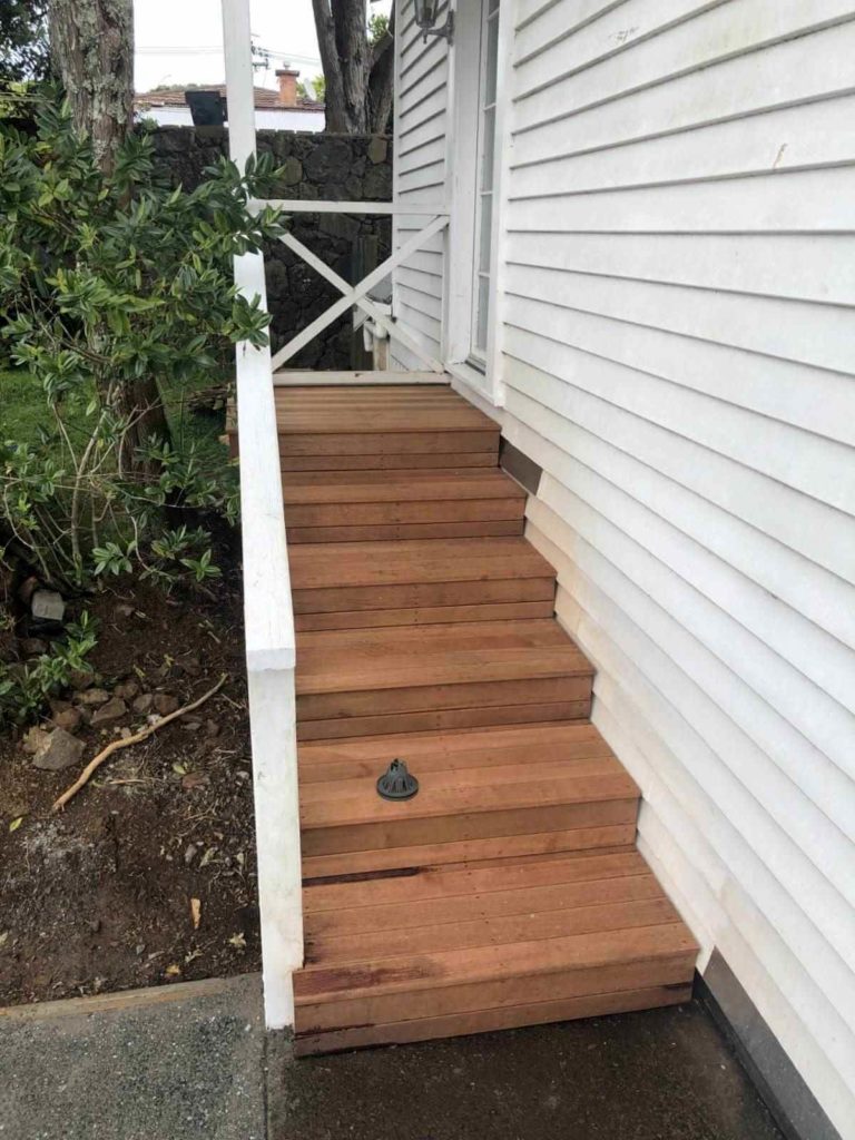 Wooden stairs leading to front door